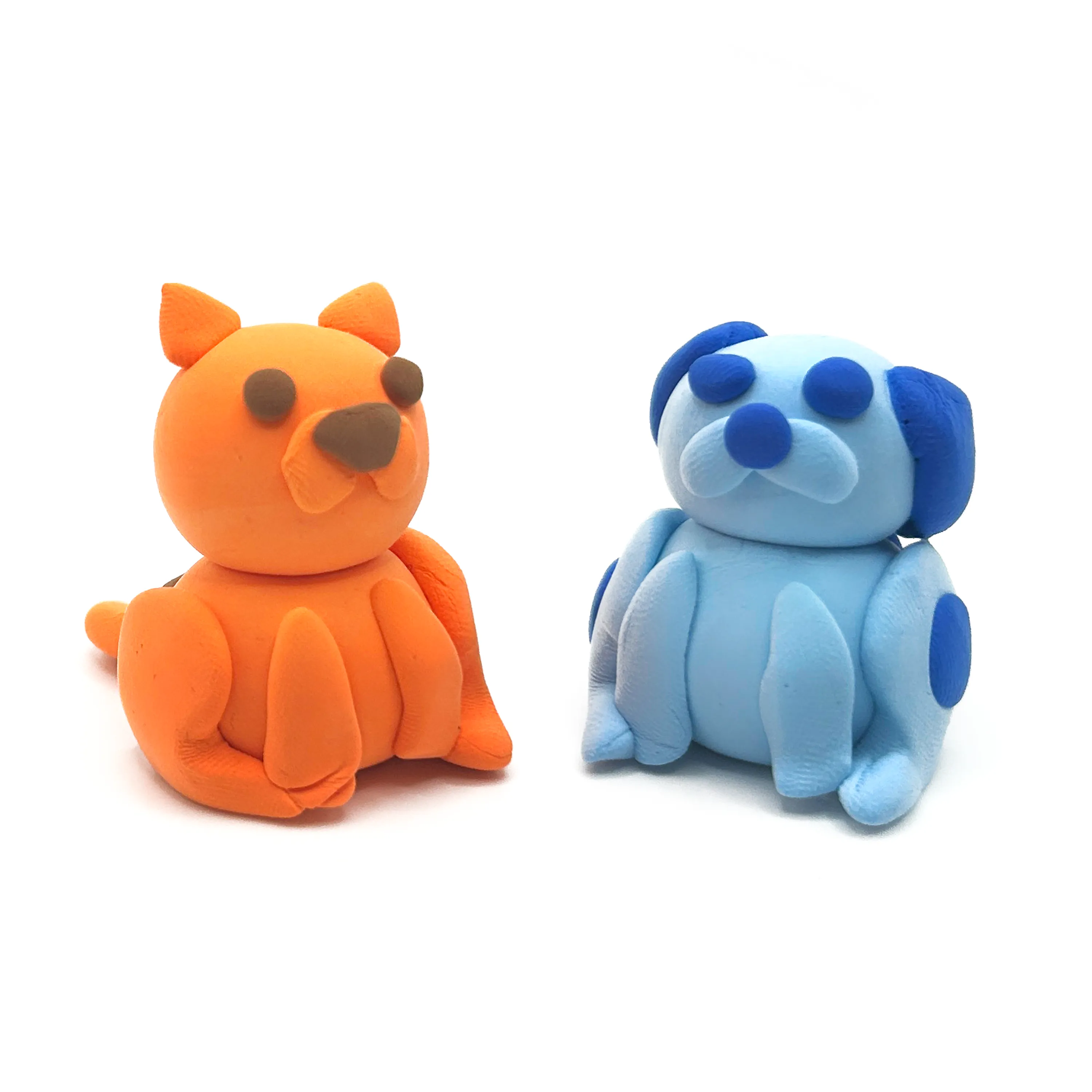 Finished clay dog and cat from OOLY Creatibles Mini Air Dry Clay Kit - Pet BFFs