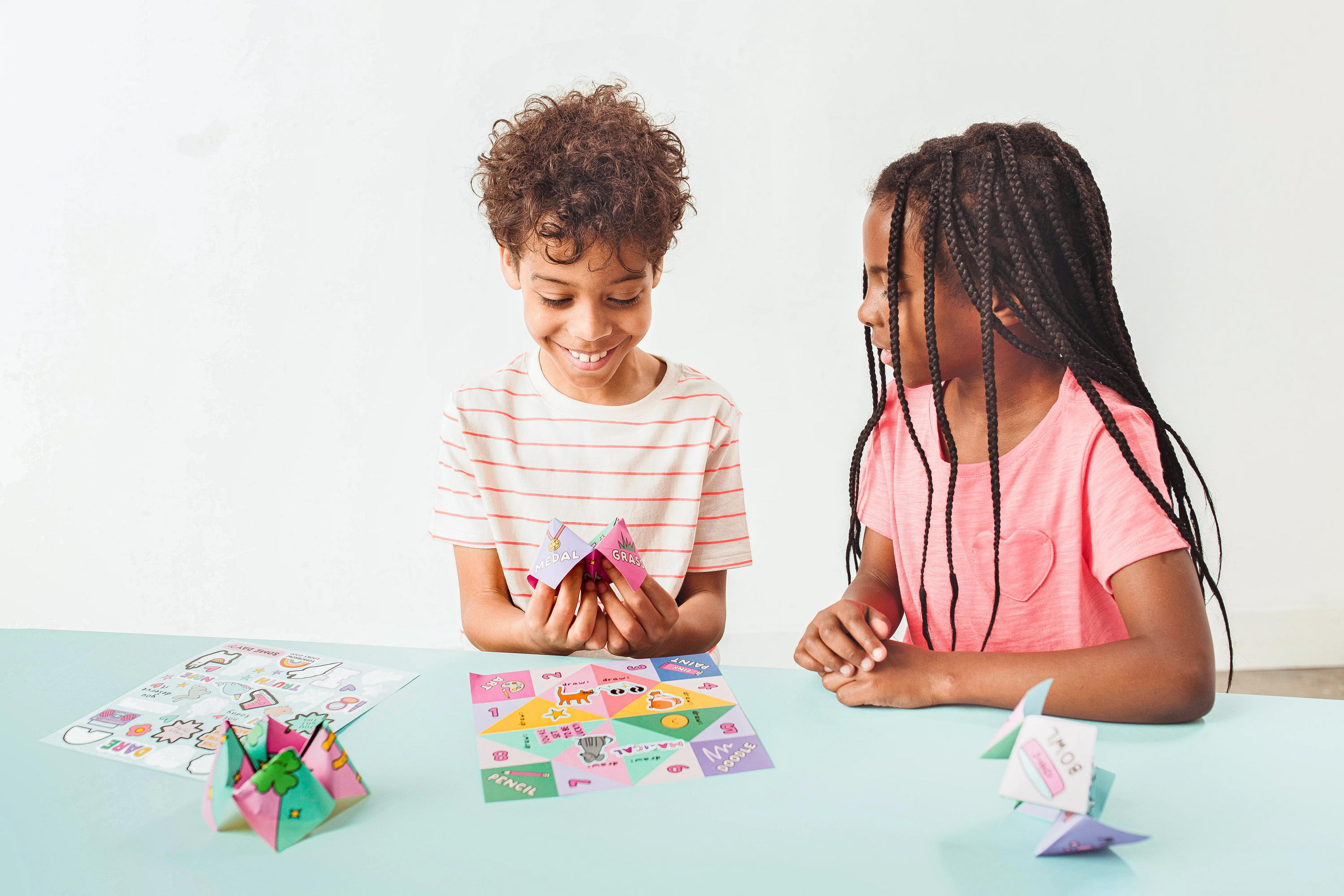 Kids playing with fortune teller from OOLY DIY Fortune Tellers Activity Kit