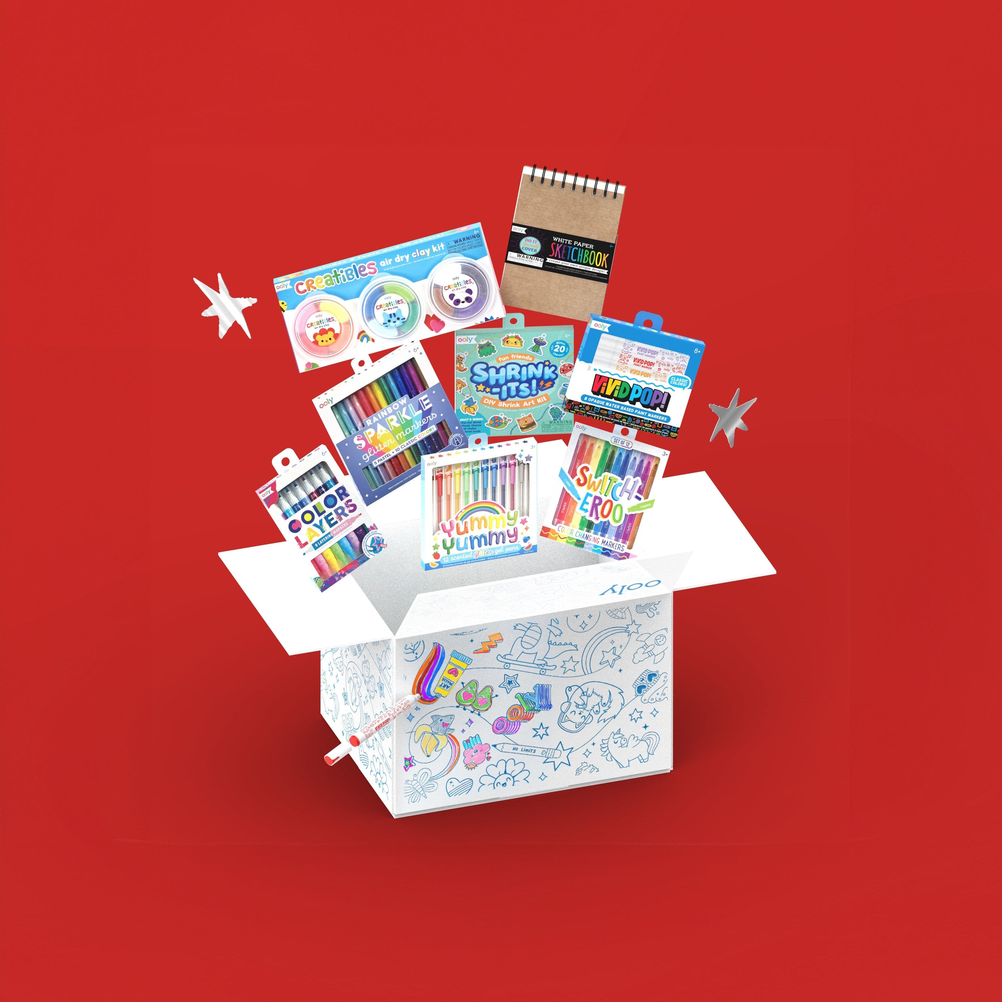 OOLY Faves Bonus Box with products coming out of colorable box on red background