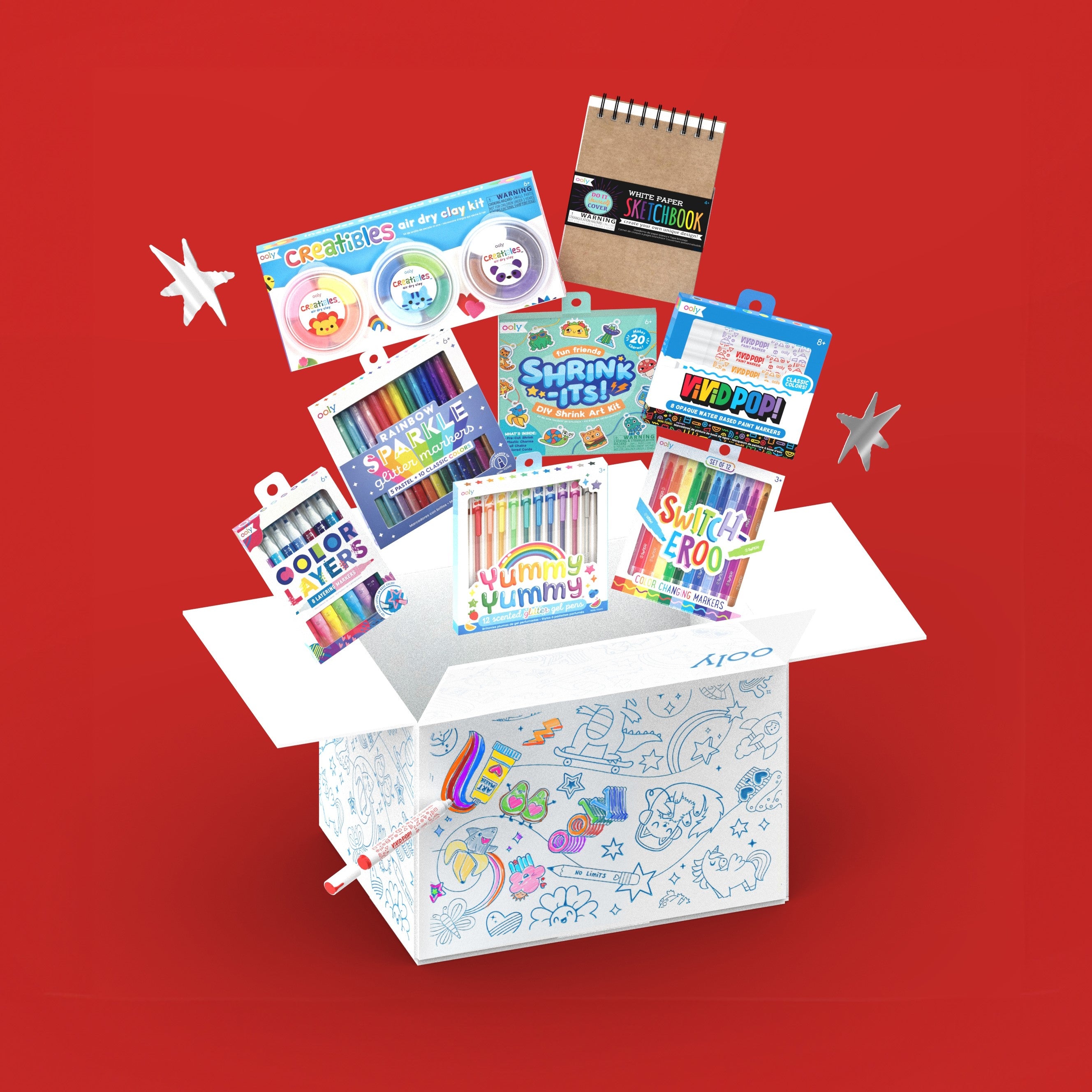 OOLY Faves Bonus Box with products coming out of colorable box on red background