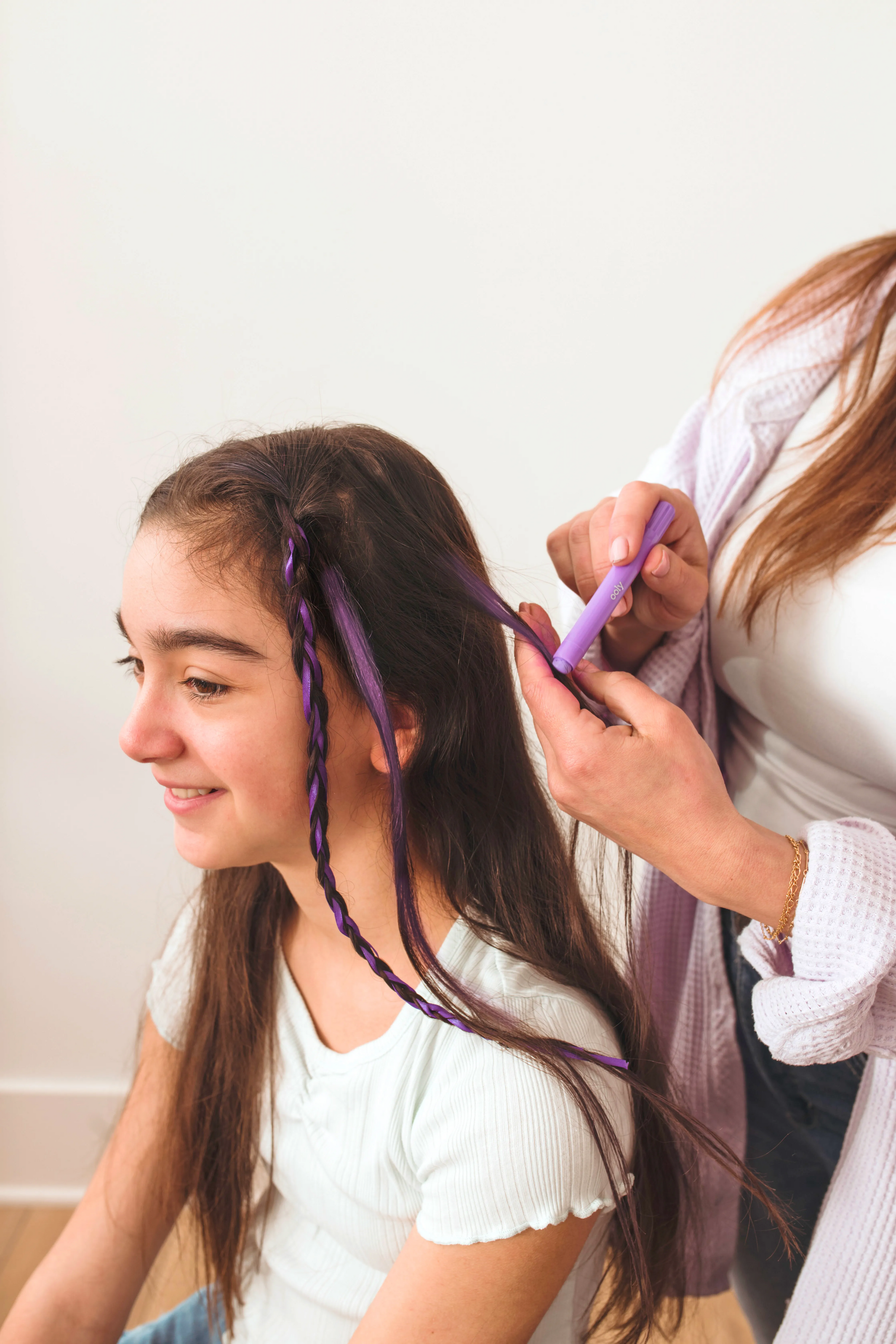 Coloring hair purple on girl with OOLY Hair Doodlers Hair Crayons