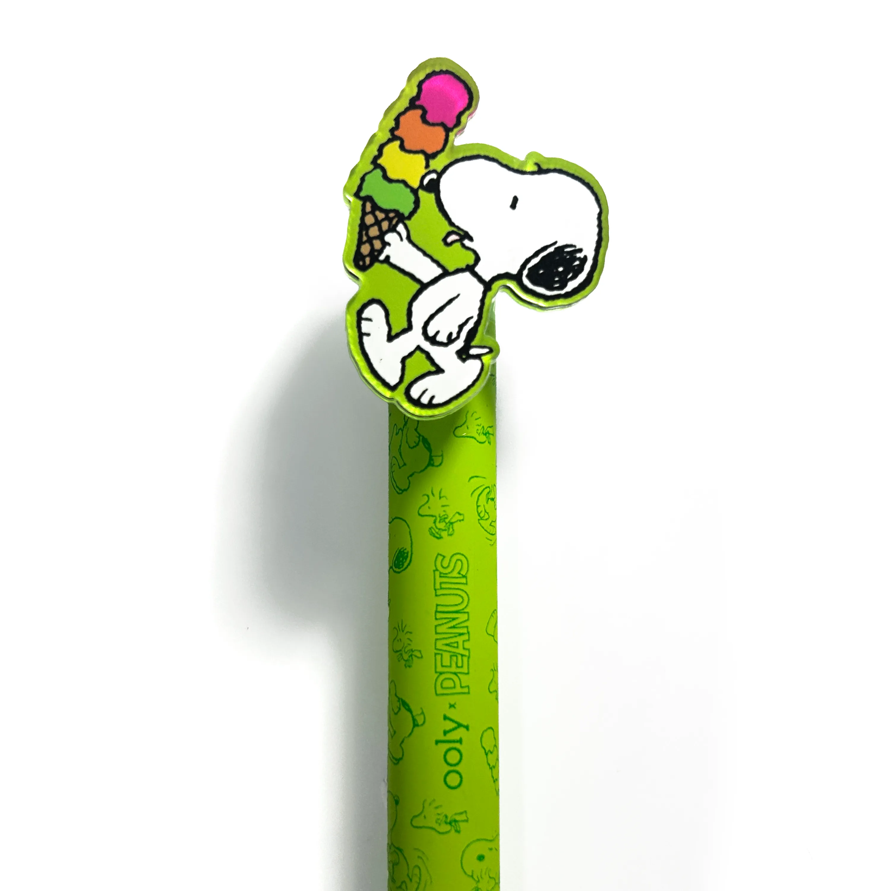 Close up of green pen topper of Snoopy eating ice cream from the OOLY x Peanuts - Black Ink Retractable Gel Pens set