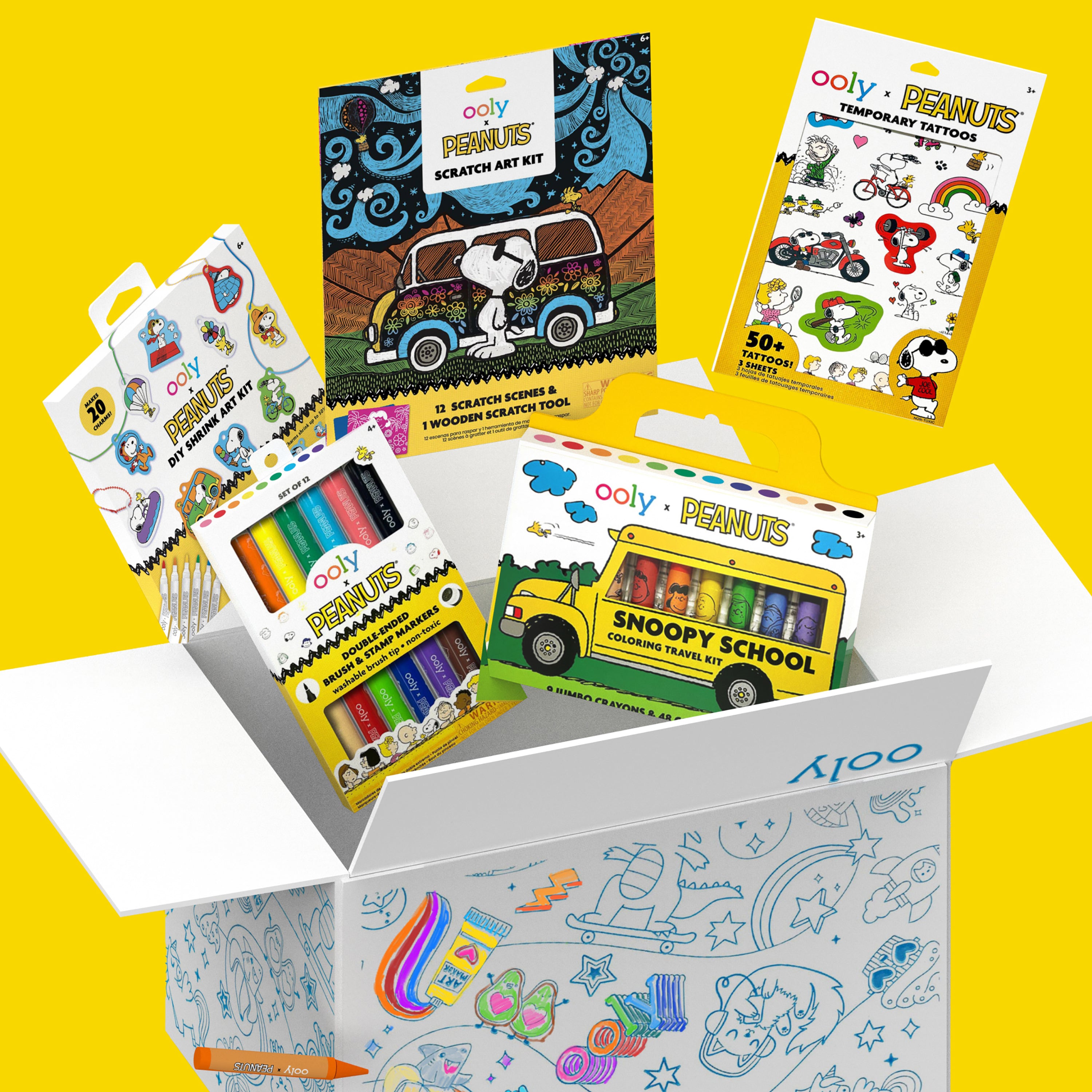 Open colorable OOLY box with content coming out of OOLY x Peanuts Bonus Box