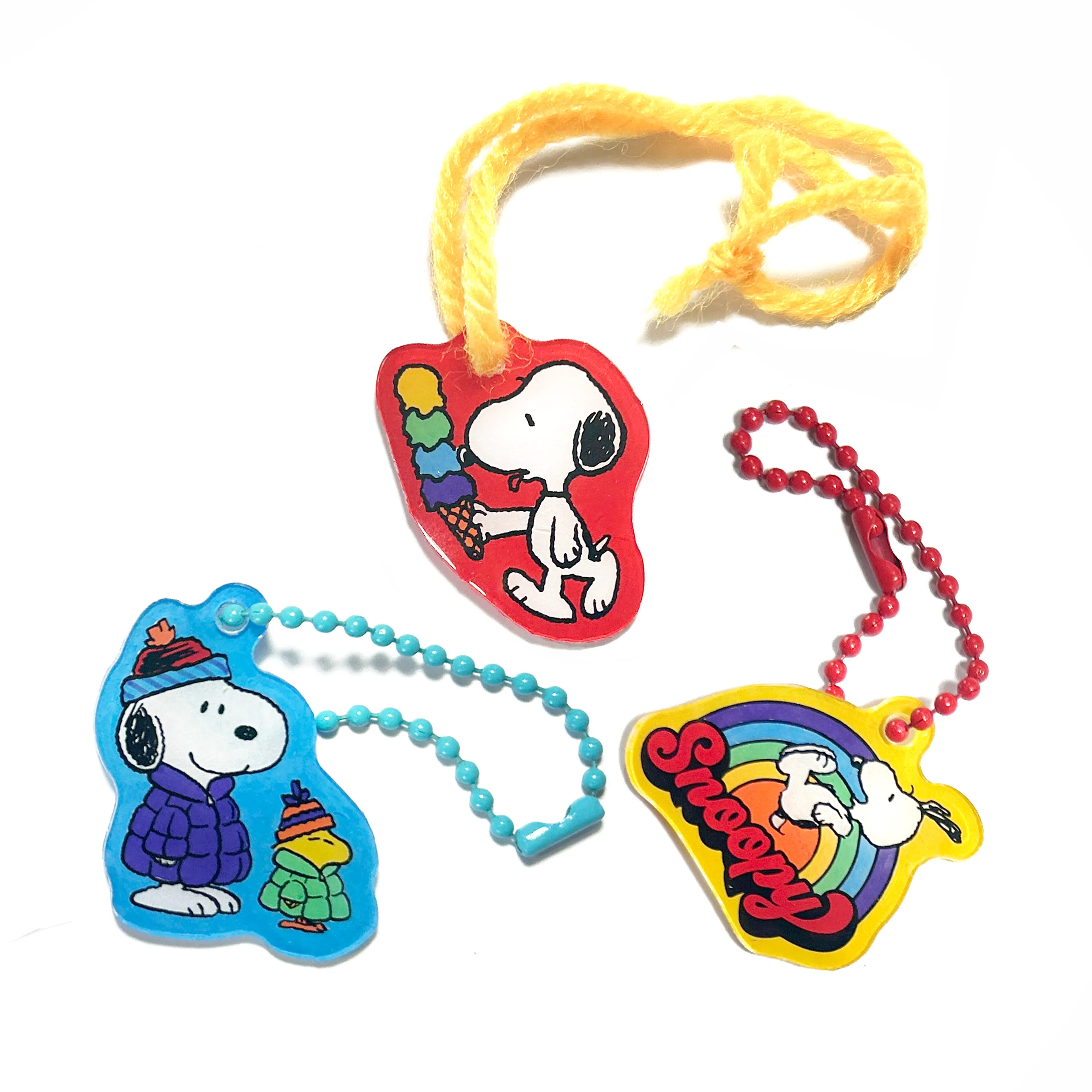 3 Snoopy charms from the OOLY x Peanuts DIY Shrink Art Kit