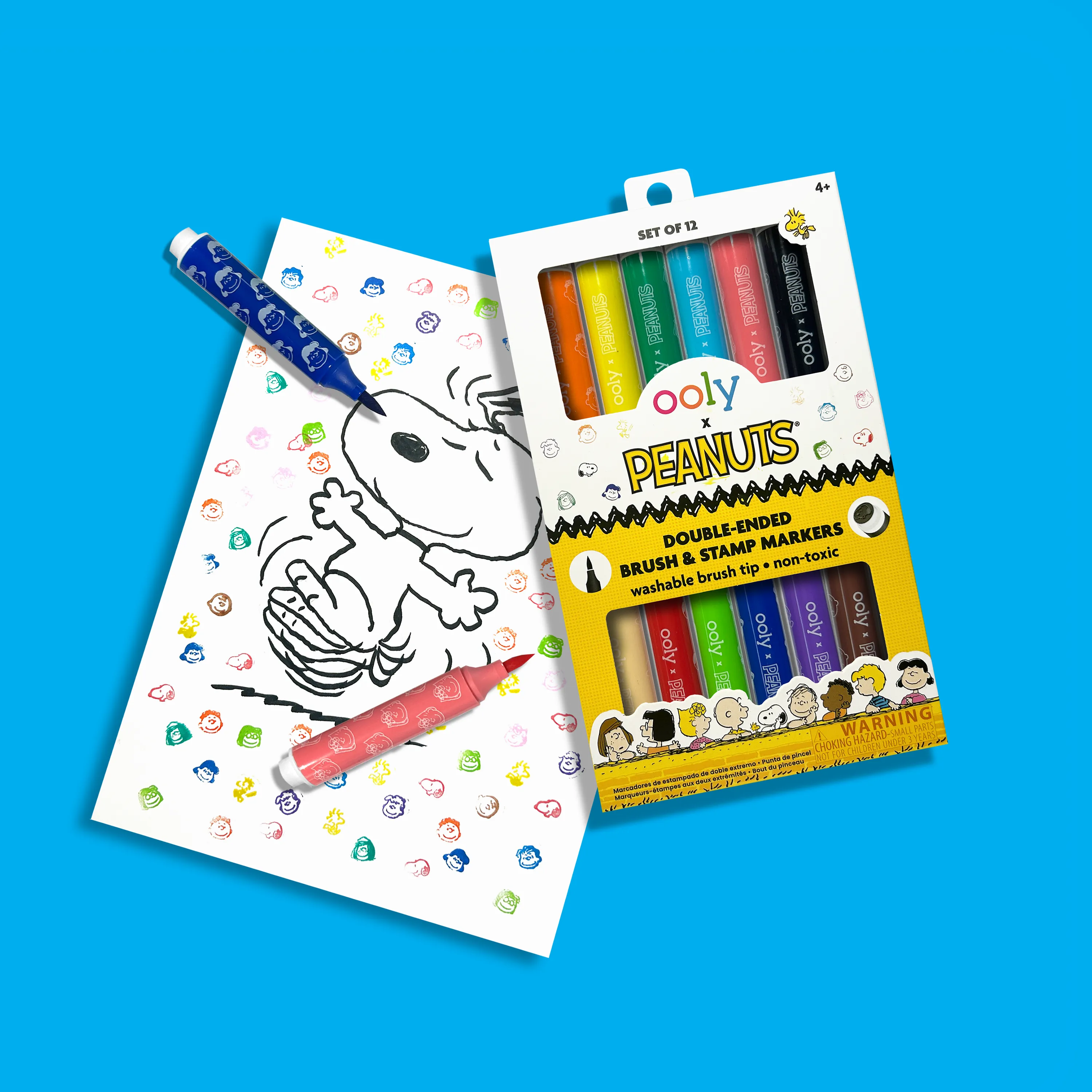 Set of OOLY x Peanuts Double-Ended Brush & Stamp Markers and drawing of Snoopy with stamps