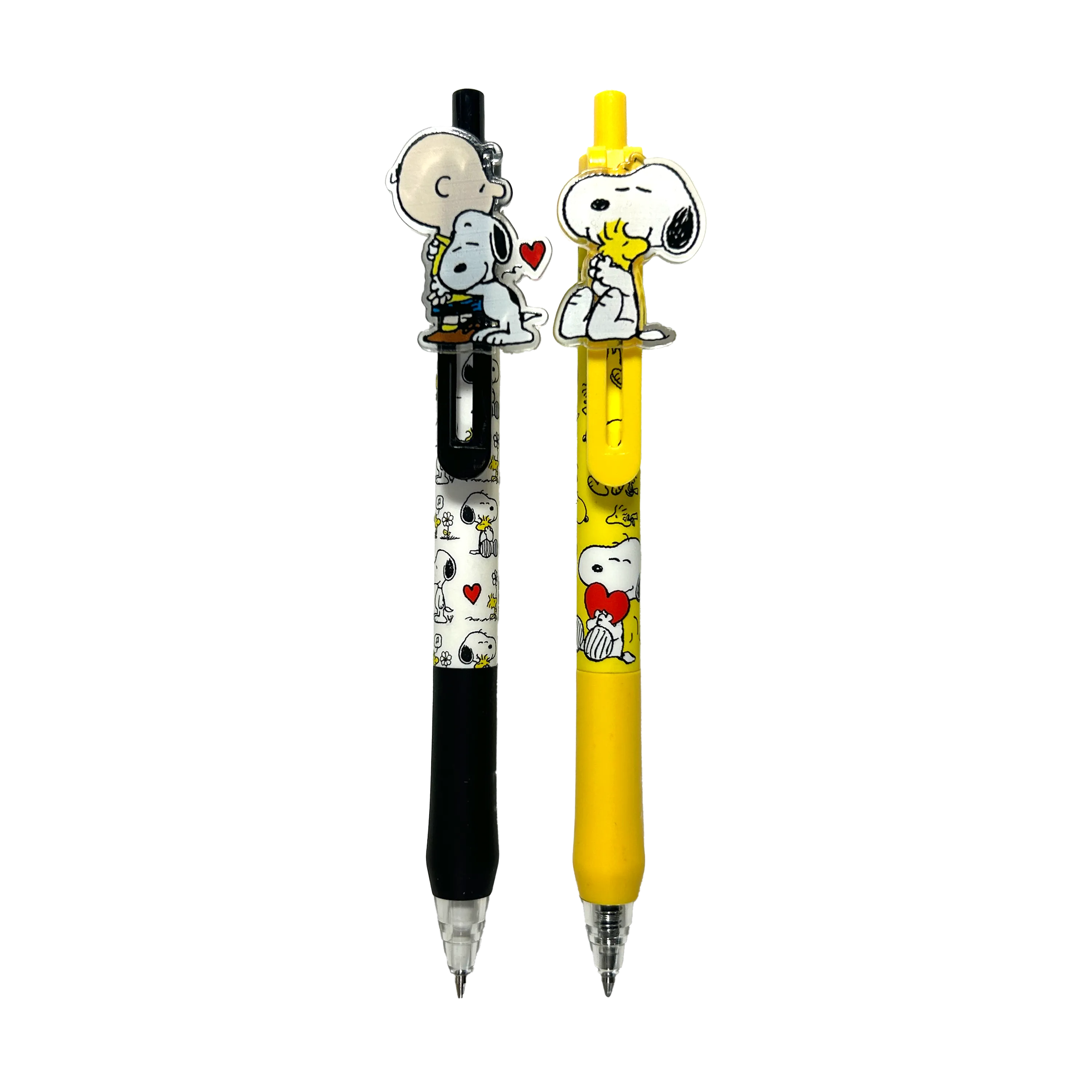 Charlie Brown black mechanical pencil and Snoopy yellow gel pen from a set of OOLY x Peanuts - Gel Pen and Mechanical Pencil