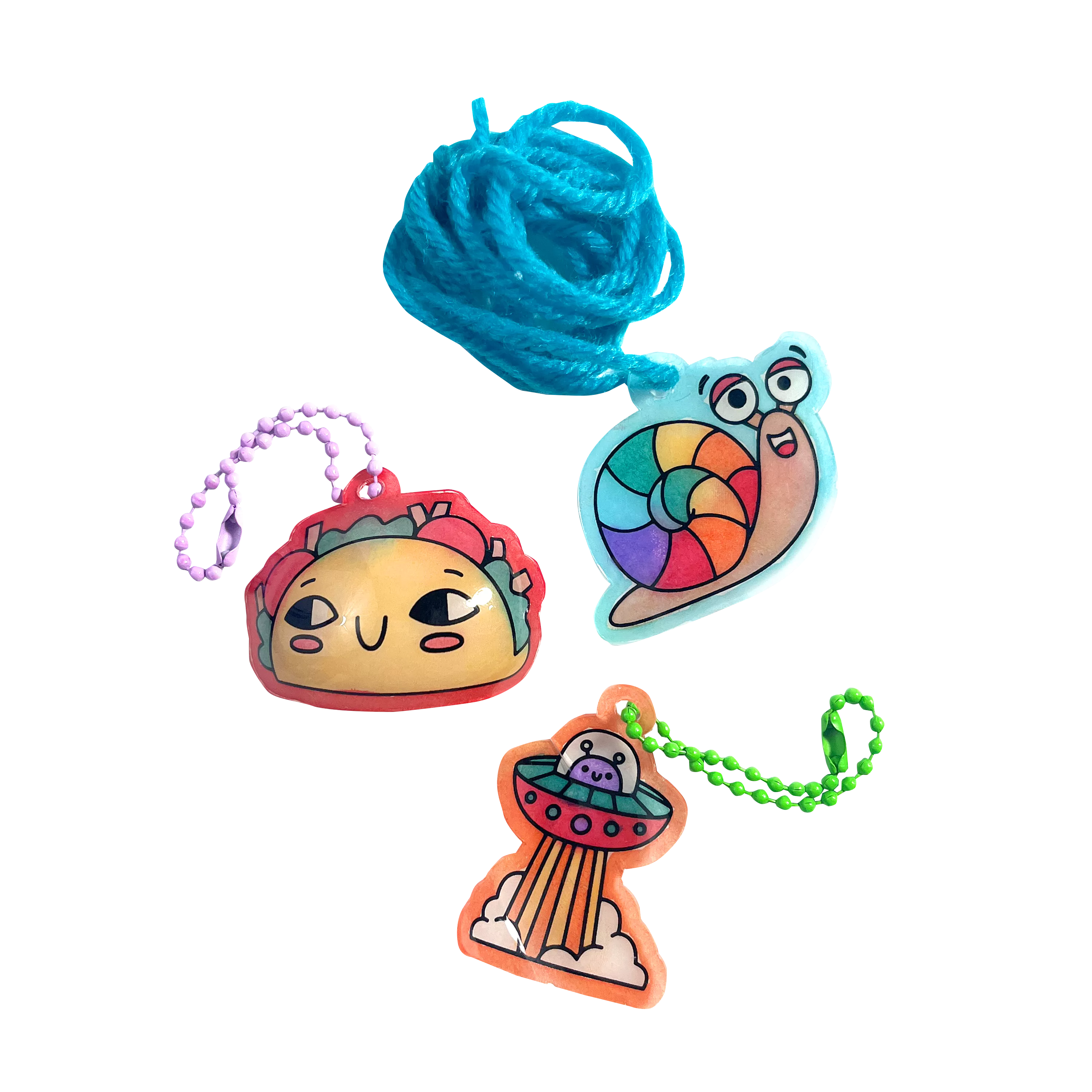 Finished charms of taco, snail and UFO from Shrink-its! DIY Shrink Art Kit - Fun Friends