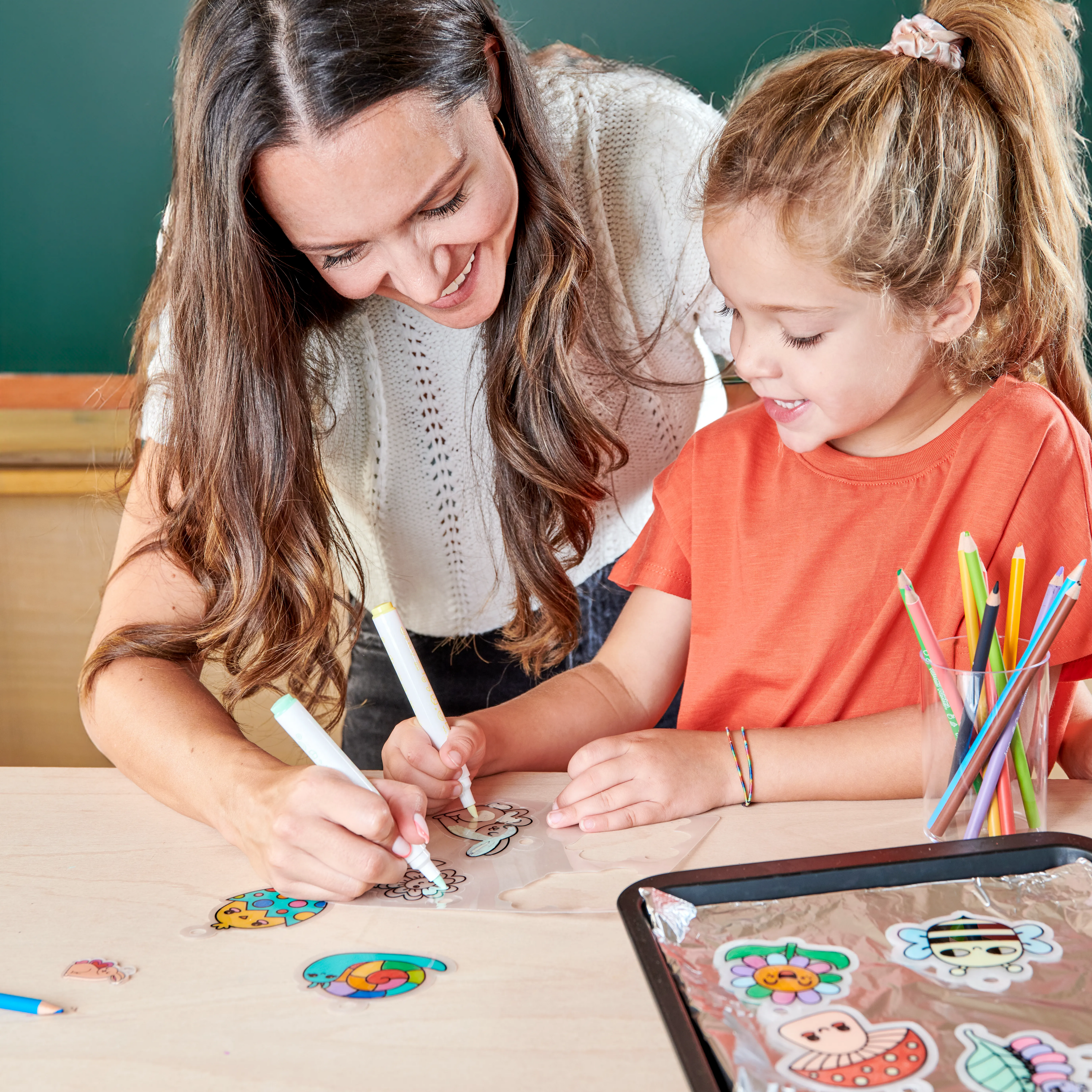 Mom and daughter coloring charms from the OOLY Shrink-its! DIY Shrink Art Kit - Garden Pals set