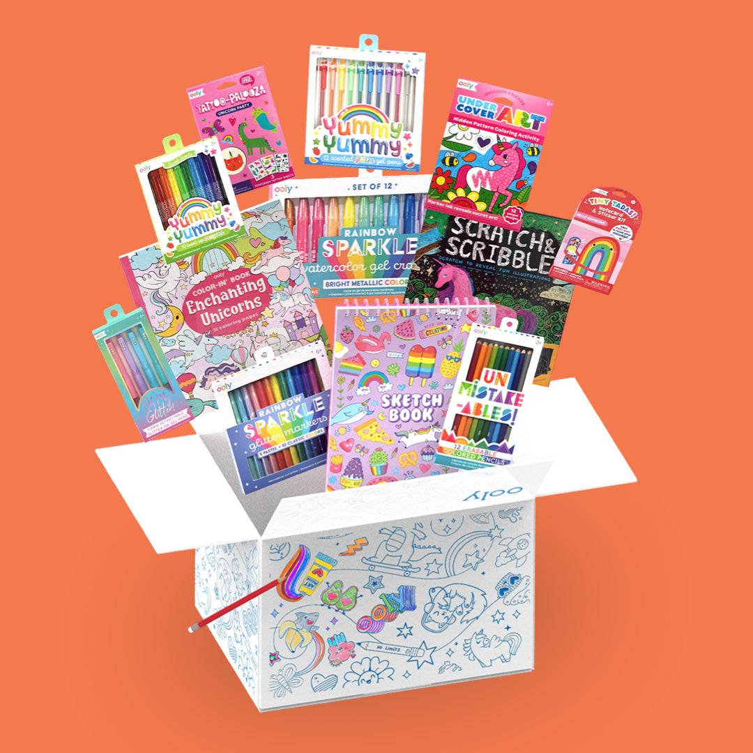 Collection of products coming out of coloring box from OOLY Ultimate Unicorn and Rainbows Bonus Box